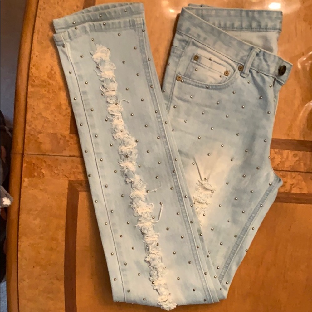 Light wash distressed denim jeans